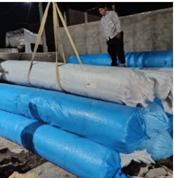 ورود رولهای چمن مصنوعی پروژه بزرگ ورزشی عطاملک جوینی به شهر نقاب